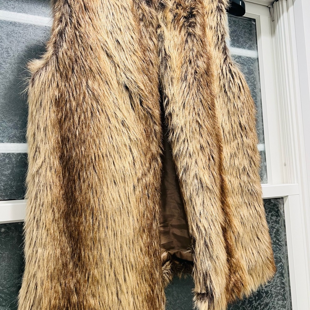 Faux Fur vest worn once. Beautiful w black jeans or leggings